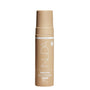 Nuda bronzer foam bottle on a white background