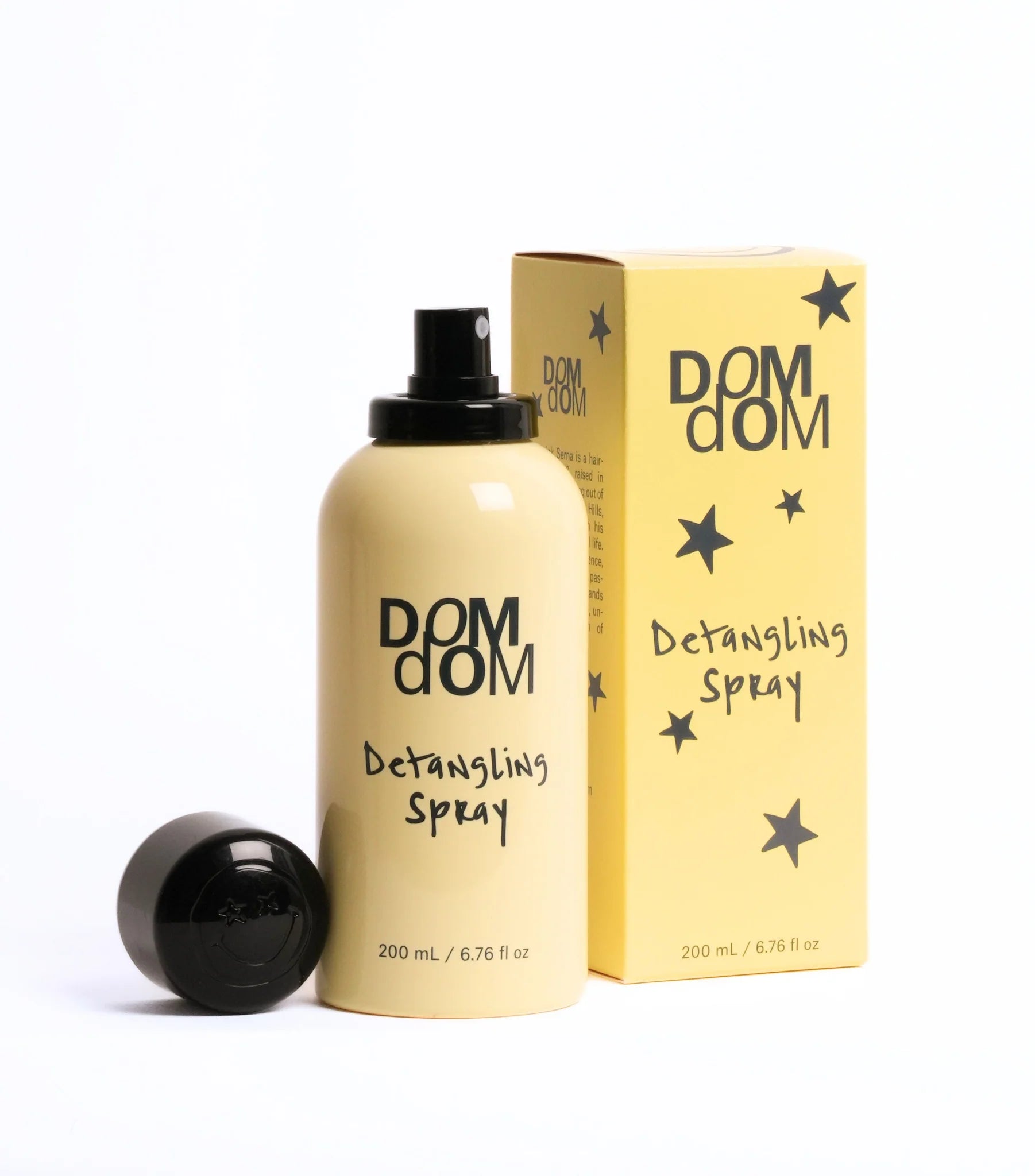 DOM DOM detangling spray bottle and packaging on a white background