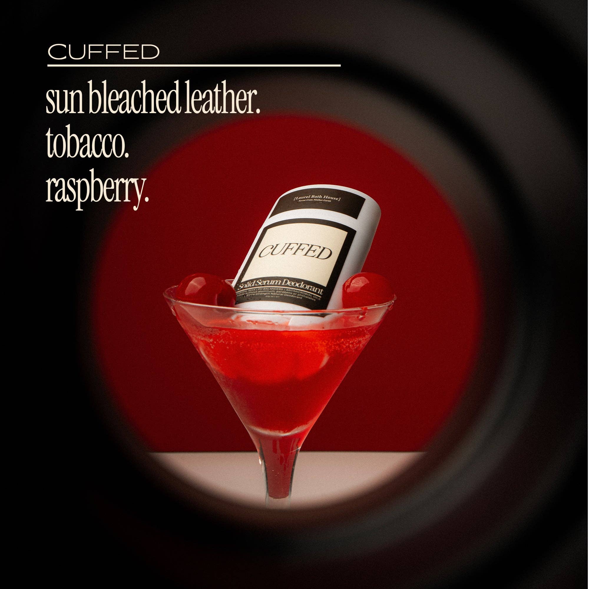 Cuffed product in a red cocktail with a dark background