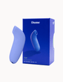 Blue personal massager twith 'Dame' packaging on a white background