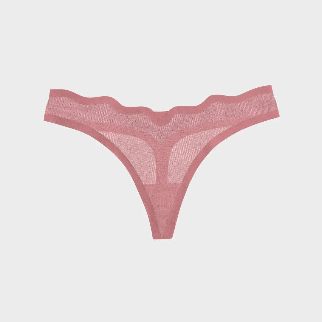 A pair of sheer mesh thong panties in a dusty rose pink color, displayed flat against a light gray background.