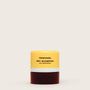 Ceremonia dry shampoo bar with yellow top and brown bottom on a white background