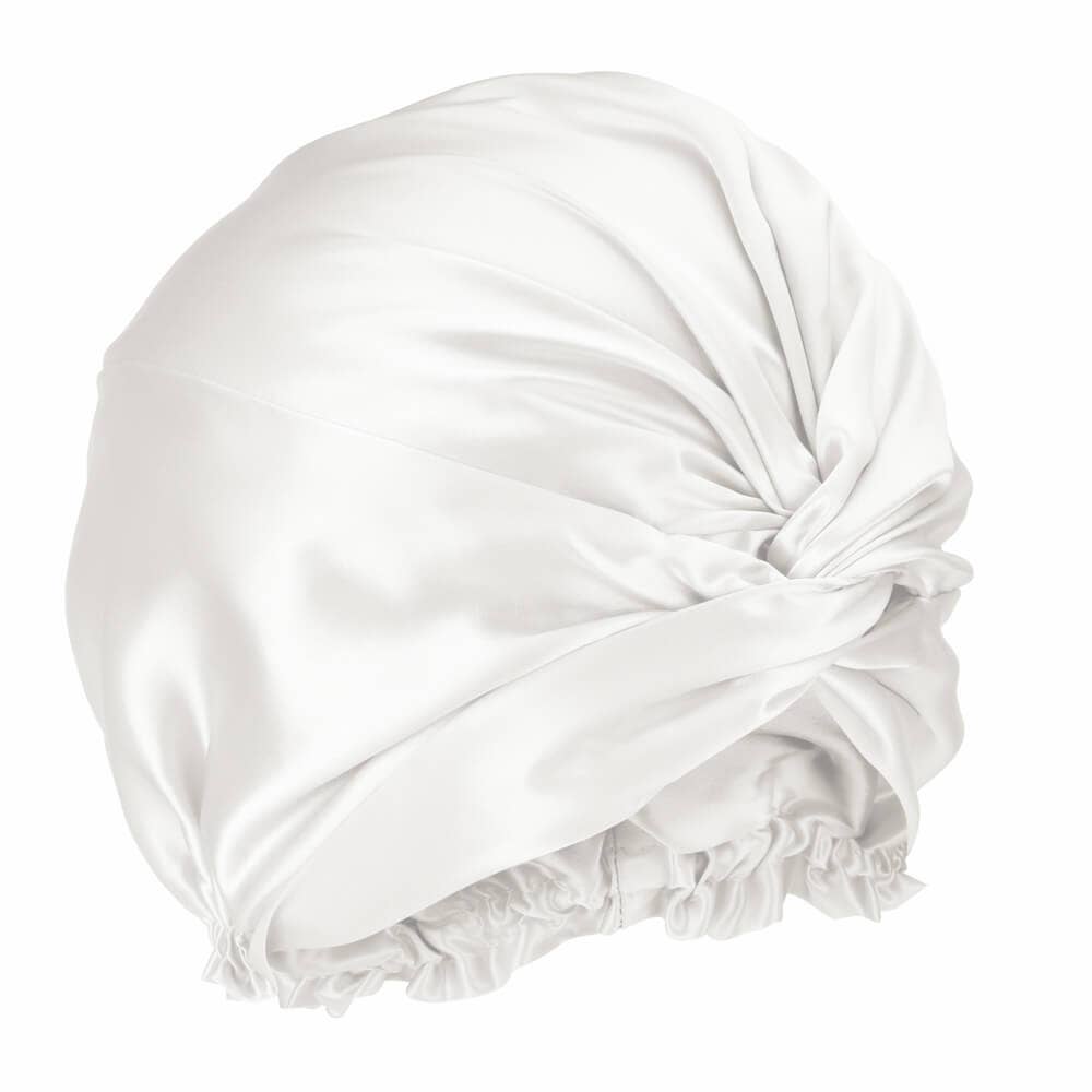 White satin bonnet with ruffled edge on a white background