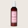 Ceremonia Guava Leave-In Conditioner bottle on a beige background