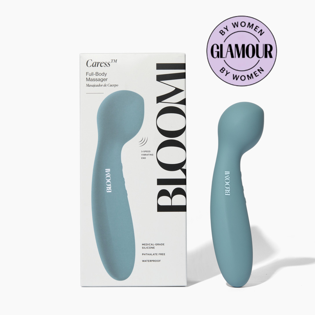 Blue personal massager device with 'Bloom' branding and packaging on a white background
