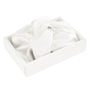 White silk bonnet with a bow in a box on a white background