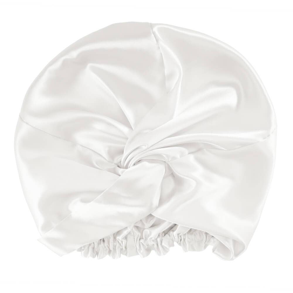 White satin bonnet on a white background