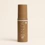 Brown bottle with Nuda branding on a beige background