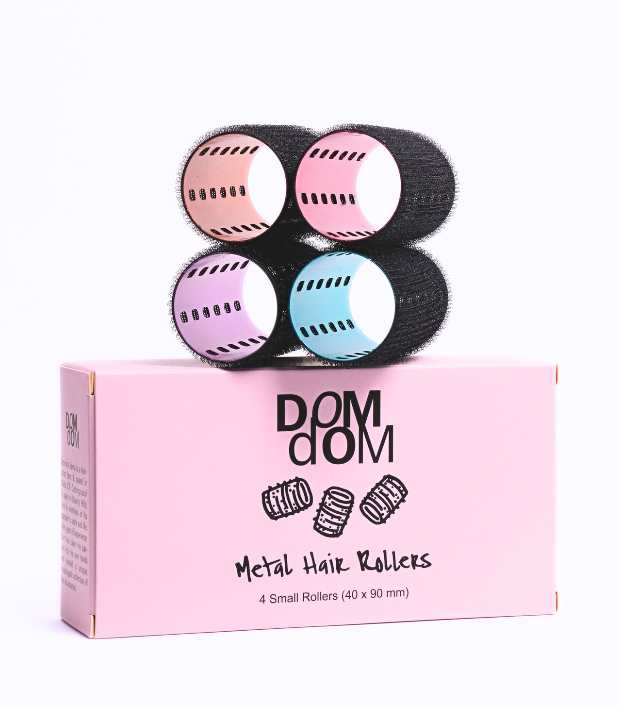 Set of metal hair rollers with a pink box labeled 'DOM DOM' on a white background