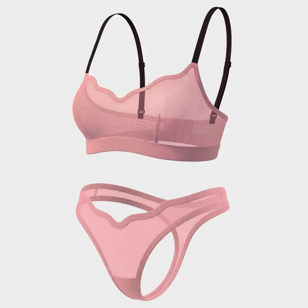 A two-piece lingerie set featuring a sheer pink mesh bralette with black underwire and adjustable straps, and a matching sheer pink mesh thong, shown against a light gray background.