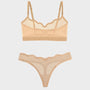 A two-piece sheer lingerie set in a light peach-beige color, featuring a scalloped underwire bralette and matching thong with mesh panels and lace trim, displayed on a light gray background.