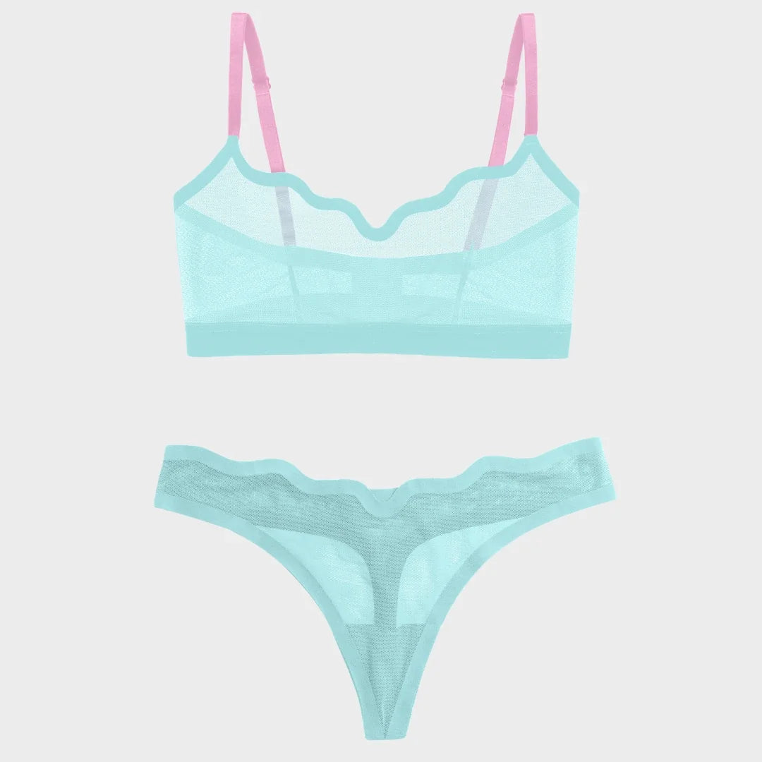 A two-piece lingerie set featuring a sheer mesh bralette with pink straps and matching lace panties in a light aqua/mint color, displayed on a solid light gray background.