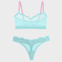A two-piece lingerie set featuring a sheer mesh bralette with pink straps and matching lace panties in a light aqua/mint color, displayed on a solid light gray background.