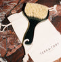 dry body brush on a brown marble background