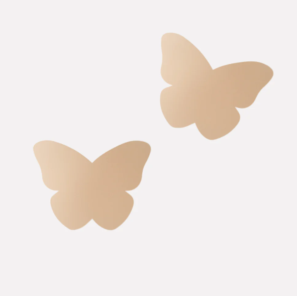 Butterfly-shaped beige pasties on a white background