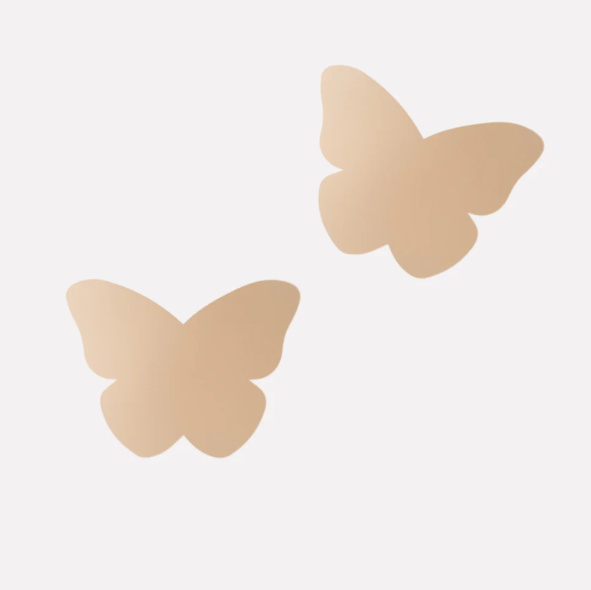 Butterfly-shaped beige pasties on a white background