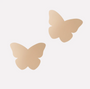 Butterfly-shaped beige pasties on a white background