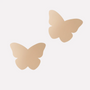 Butterfly-shaped beige pasties on a white background