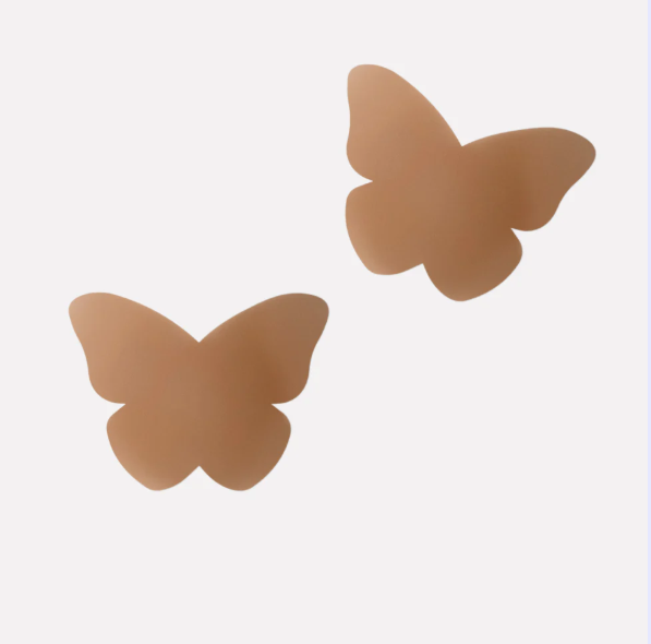 Butterfly-shaped beige pasties on a white background