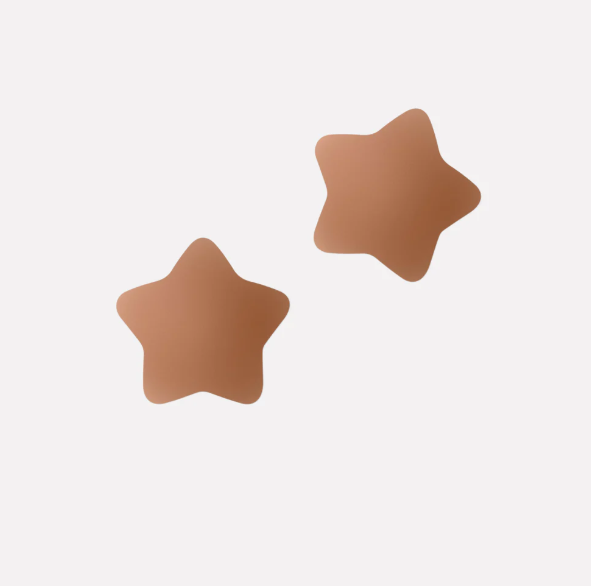Pair of star-shaped brown pasties on a light gray background