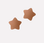 Pair of star-shaped brown pasties on a light gray background