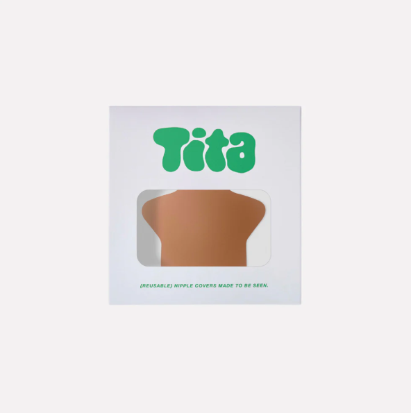 Tita brand packaging with a brown star nipple cover inside on a white background