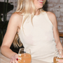 Woman holding a glass of beer with a blurred background