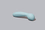 Light blue handheld massager with 'Bloom' branding on a gray background