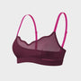 A women's wireless bra with a deep plum purple mesh and fabric body, featuring bright pink adjustable shoulder straps, shown against a solid cream background.