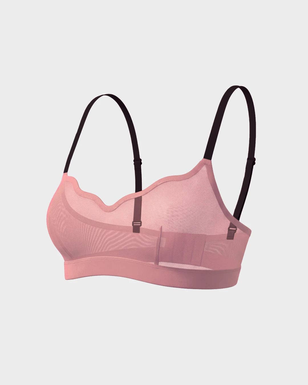 A light pink seamless underwire bra with black adjustable shoulder straps, shown against a light gray background.