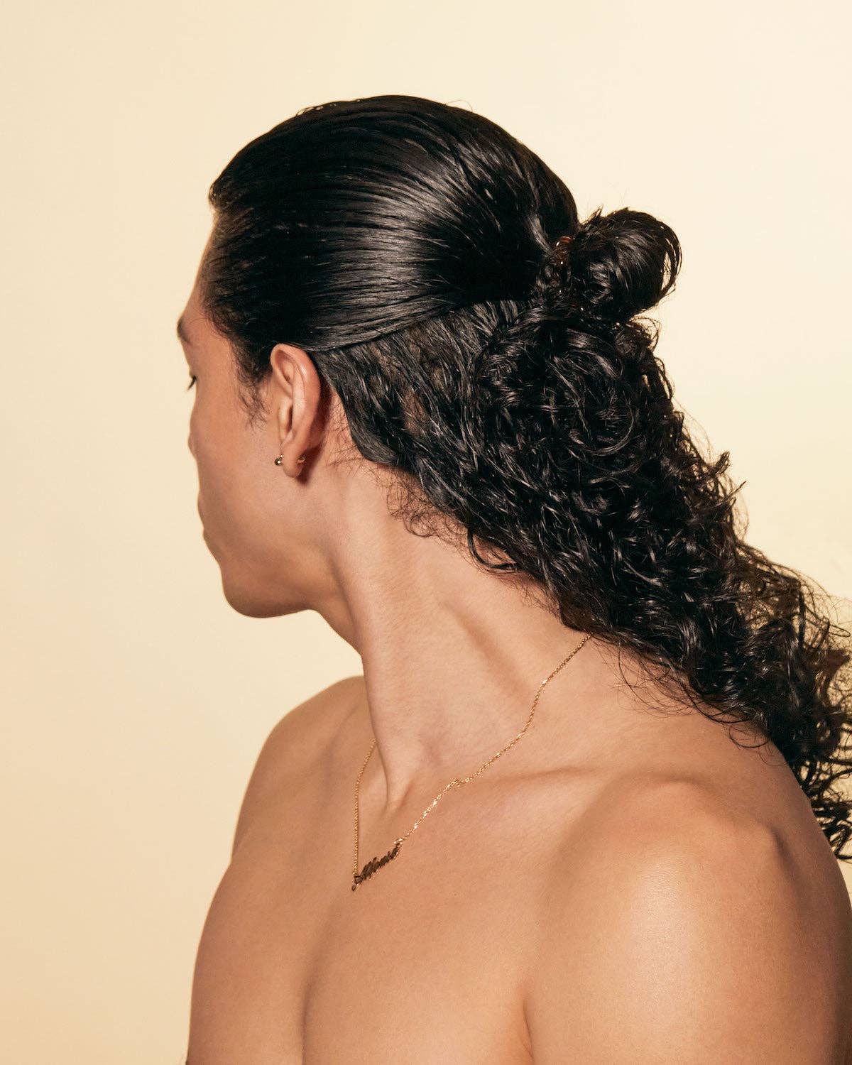 Man with styled hair on a beige background