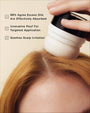 Person applying a scalp care product with text highlighting its benefits on a beige background