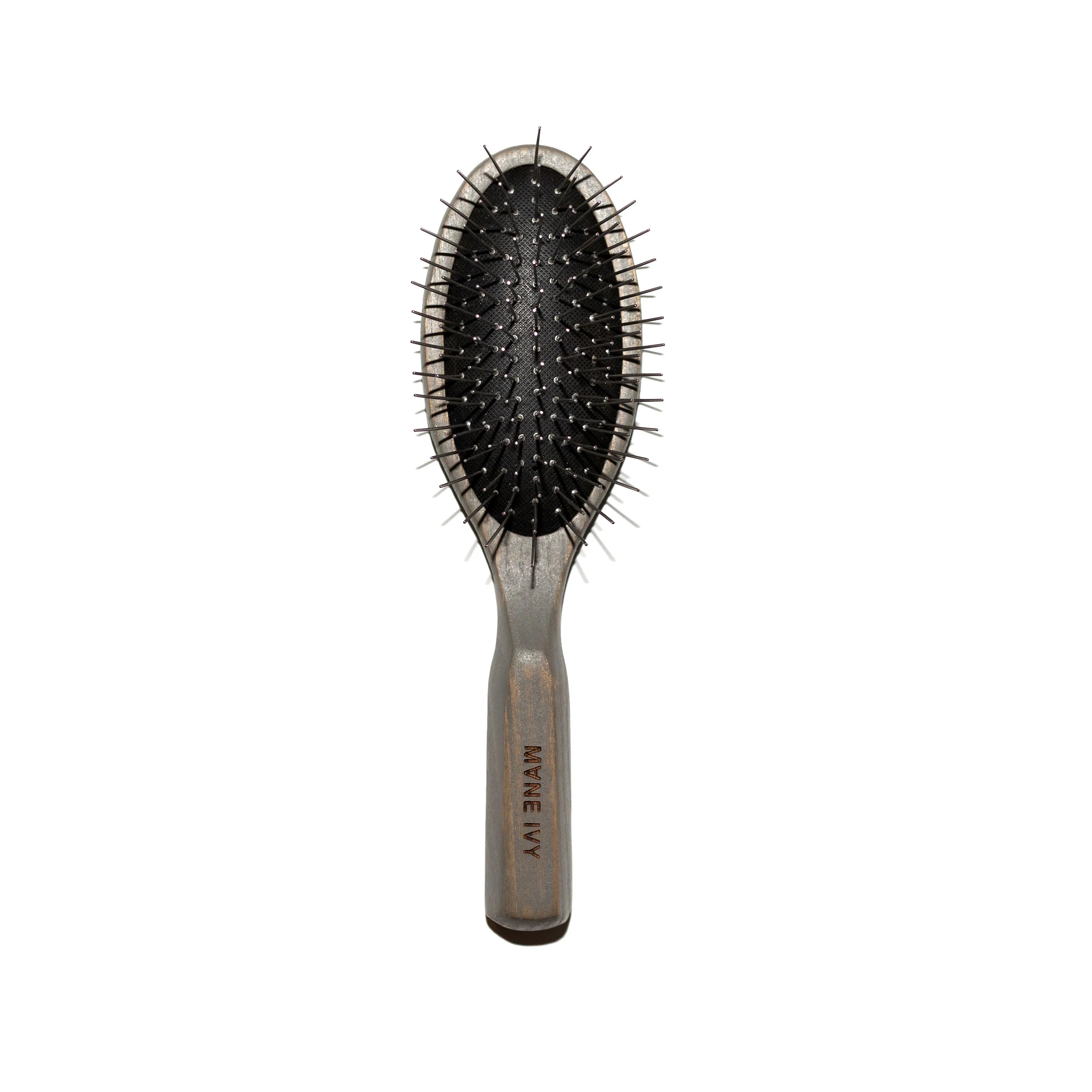 Hairbrush with black bristles on a white background