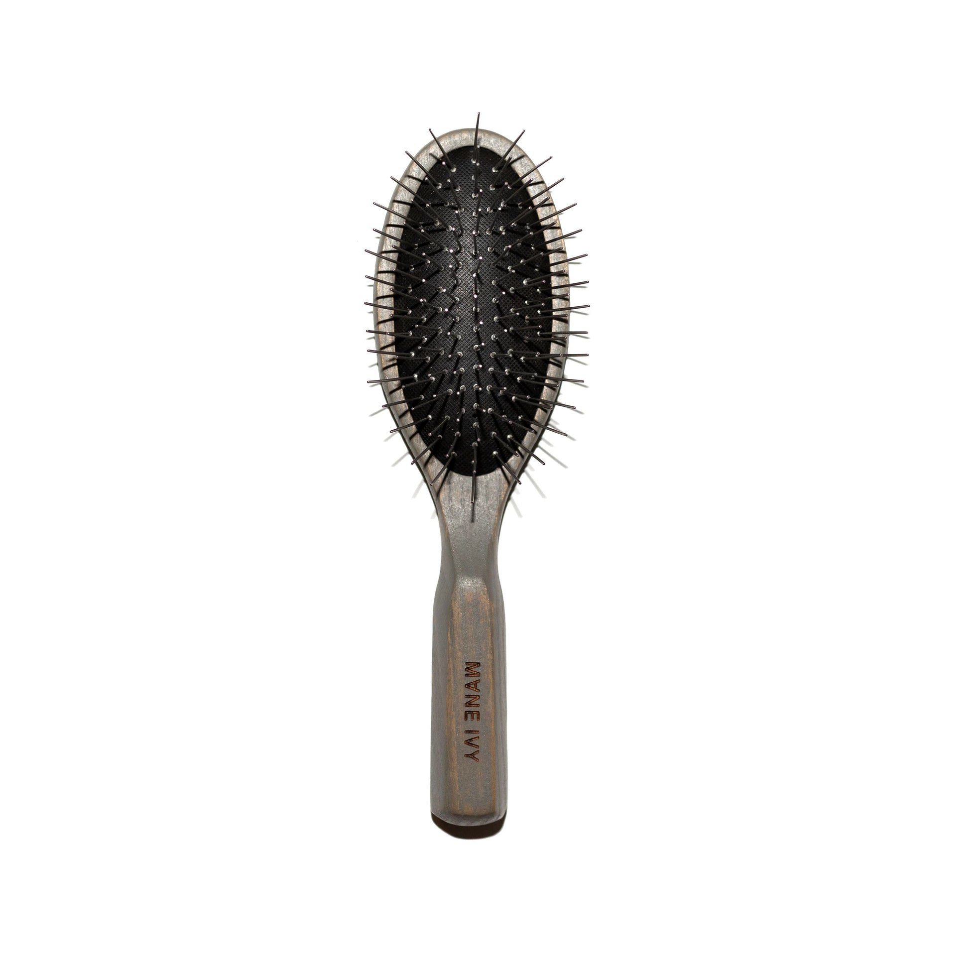 Hairbrush with black bristles on a white background